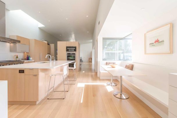 Kitchen in wood colors with beautiful controlled lighting