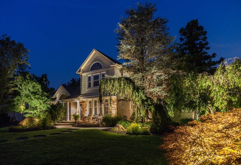 Landscape Lighting system for beautiful two-story home. 