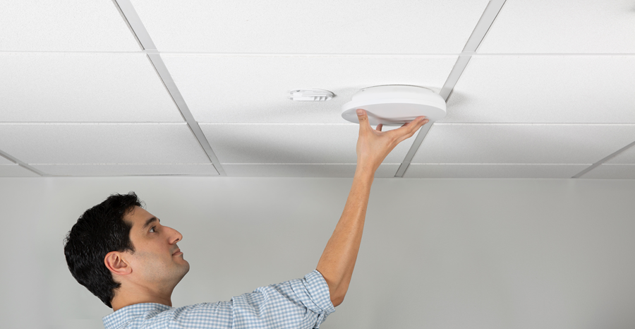 Technician installing an access point for a Los Angeles business space.